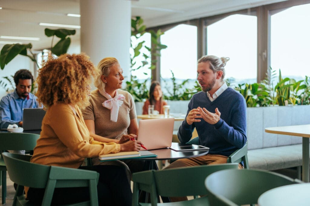 Colleagues talking about politics at work